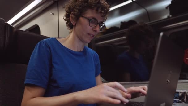 Woman Curly Hairs Glasses Working Laptop While Going Train Evening — Video Stock