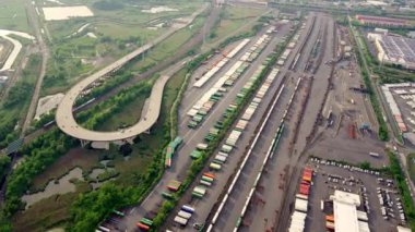 Aerial of a Brooklyn Industial Area, River and Highways. Filmed From a Helicopter. Wide Panoramic Panning Shot