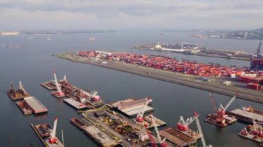 Aerial Over Brooklyn Port Cranes and Containers, New York Filmed From a Helicopter. Panoramic Trucking Shot