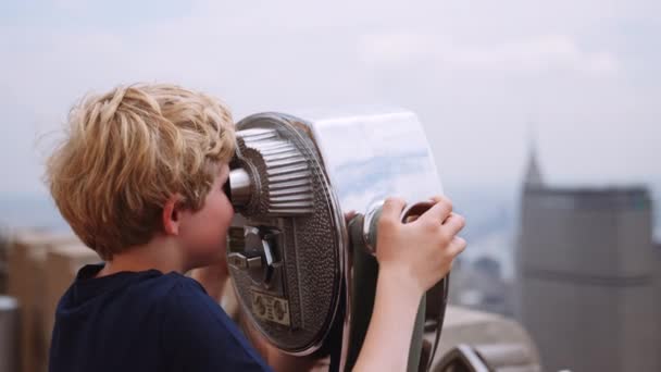 Medium Slow Motion Handheld Arcing Shot Young Boy Looking Coin — Stock video