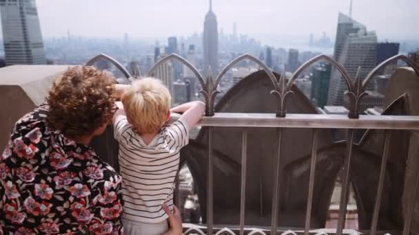 Medium Slow Motion Arcing Shot Mother Young Son Looking Railings — Video Stock