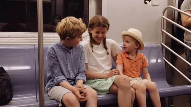 Girl Two Younger Brothers Ride Subway Sit Metro Coach Talk — Stockvideo