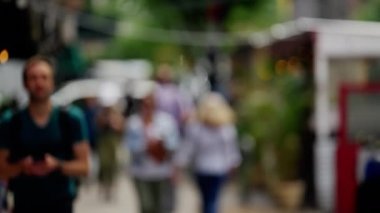 Wide Handheld Slow Motion Shot Of Pedestrians Walking Along Streets Of New York City