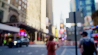 Wide Lockdown Slow Motion Shot Of Pedestrians Walking Along Streets Of New York City