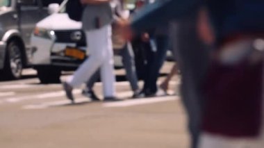 Medium Slow Motion Lockdown Shot Of Pedestrians Walking Across Street Crossing In New York City