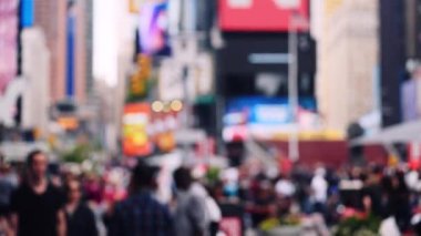 Medium Lockdown Slow Motion Defocussed Shot Of Pedestrians Walking In New York City