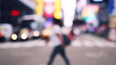 Medium Handheld Slow Motion Defocussed Shot Of Pedestrians Crossing Street In New York City