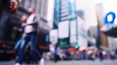 Low Angle Slow Motion Wide Defocussed Lockdown Shot Of Pedestrians Walking Along Street In New York City