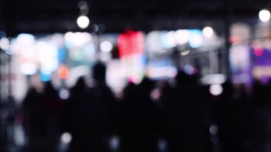 Handheld Medium Slow Motion Defocussed Shot Of Silhouettes Of Pedestrians In New York City
