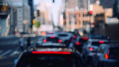Cars with Brake Lights On at the Traffic Light in the Midtown of New York. Defocused Cityscape