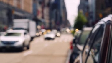 Zebra Crossing and Traffic on the Road of Midtown New York on a Bright Sunny Day. Defocused Cityscape. Slow Motion Static Shot