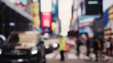 Traffic Jam on the Road of Midtown New York. Policeman Directing Traffic on the Road. Defocused Cityscape