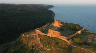 Aerial of Impressive Medieval Fortress of Hammershus Ruins at sunset, Denmark. Beautiful Landscape. Panoramic Shot. Camera Slowly Moves Forwards