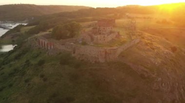 Aerial of Impressive Medieval Fortress of Hammershus Ruins at sunset, Denmark. Beautiful Landscape. Panoramic Shot. Camera Slowly Moves Forwards