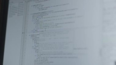 Close Up Handheld Shot Of Data Being Typed On Computer Monitor