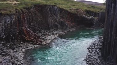 Slow Motion Wide Drone Flight Over River Running Through Studlagil Canyon, Glacier Valley, Jokuldalur, Iceland
