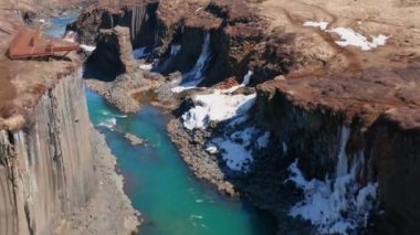 Wide Slow Motion Drone Flight Over River Running Through Studlagil Canyon, Glacier Valley, Jokuldalur, Iceland