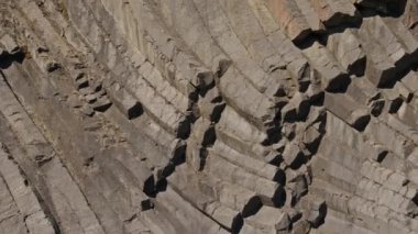 Medium Slow Motion Drone Shot Tilting Up Over Basalt Rocks Of Studlagil Canyon, Glacier Valley, Jokuldalur, Iceland