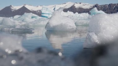 Close-up of an Ice Crystal in the Water on Diamond Beach, South Coast of Iceland. Bokeh Zoom In Shot. Focus Is on the Background