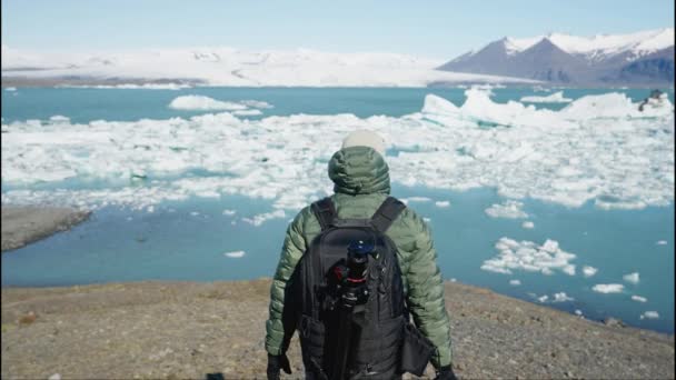 Man Photographer Backpack Tripod Camera His Hand Goes Hill Front — Stockvideo