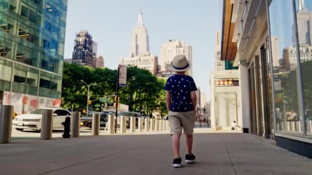Wide Slow Motion Tracking Shot Boy Hat Hands Pockets Walking — Vídeo de Stock