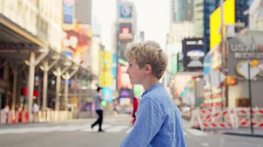 Handheld Medium Tracking Slow Motion Shot Of Young Blond Boy Crossing Road In New York City