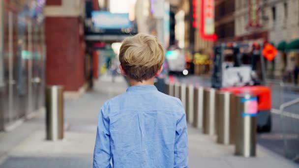 Tracking Medium Slow Motion Shot Young Blond Boy Blue Walking — Video Stock