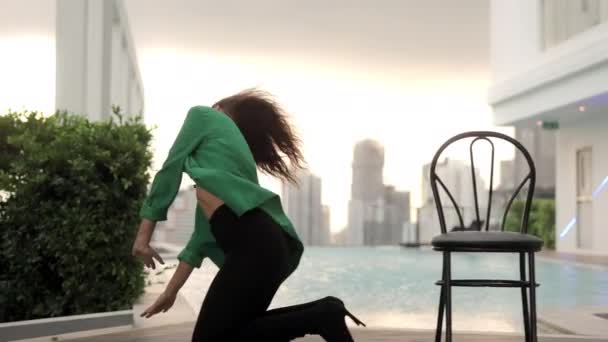 Tracking Slow Motion Wide Shot Dancer Moving Chair All Fours — Wideo stockowe
