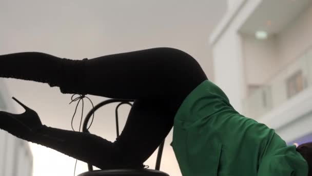 Medium Slow Motion Zoom Out Sensuous Dancer Leaning Chair High — Vídeo de Stock