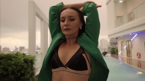 Slow Motion Medium Zoom Out Sensuous Dancer Bra Jacket Crouching — Stockvideo