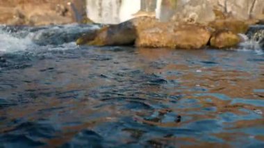 Wide Tilt Up Slow Motion Shot Of Photographer Standing On Rock In River Looking Up At The Dynjandi Waterfall, Arnarfjordur, Westfjords, Iceland