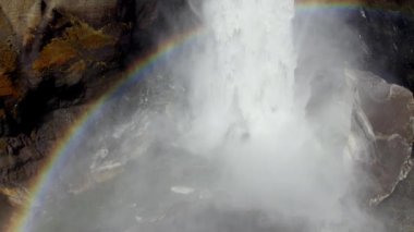 Aerial of Majestic Haifoss Waterfall and Rainbow Around It. Spectacular Scenery of Iceland.  Slow Motion High Angle Shot