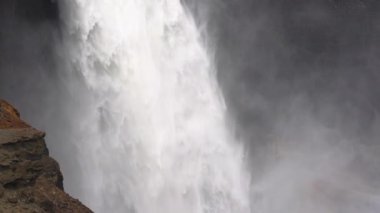 Close-up of Haifoss Waterfall. Water Flows Falling Down with Power. Spectacular Scenery of Iceland. Slow Motion Tilt Down Shot