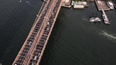 Aerial Over Brooklyn Bridge with Traffic and East River on a Bright Sunny Day, New York. High Angle Shot