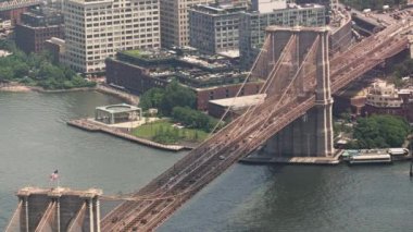 Aerial Over the Brooklyn Bridge with Traffic and East River on a Bright Sunny Day, New York. Static Shot
