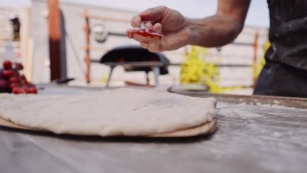 Slow Motion Close Dolly Shot Man Spooning Pizza Sauce Pizza — Stock Video
