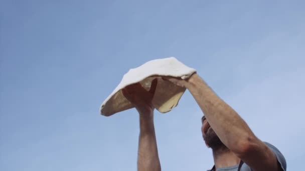 Slow Motion Medium Handheld Shot Man Tossing Pizza Dough Air — Vídeo de Stock
