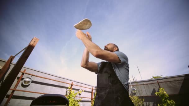 Slow Motion Medium Handheld Shot Man Tossing Pizza Dough Στον — Αρχείο Βίντεο