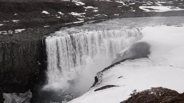 Wide Slow Motion Drone Flight Tilting Dettifoss Waterfall Snow Ice — Stockvideo