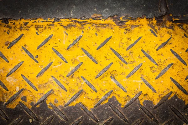 Pintura de chapa de aço escuro com padrão amarelo — Fotografia de Stock