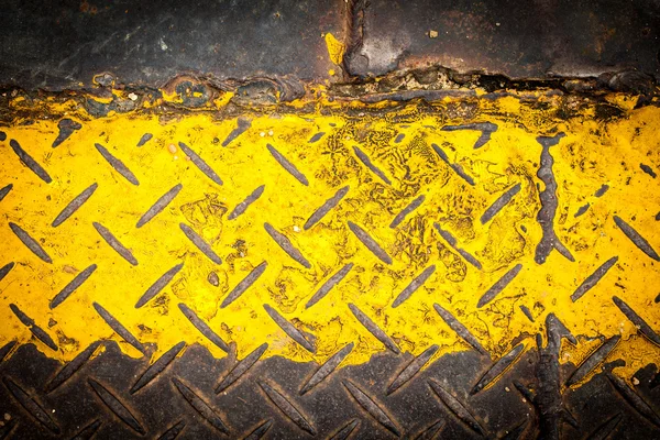 Pintura de chapa de aço escuro com padrão amarelo — Fotografia de Stock