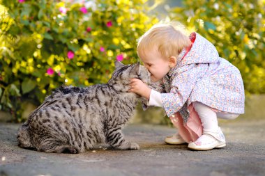 Portrait of a little girl with a cat clipart