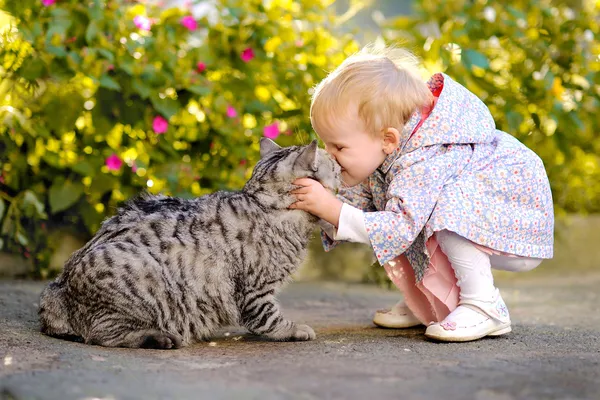 Portrait of a little girl with a cat Stock Photo