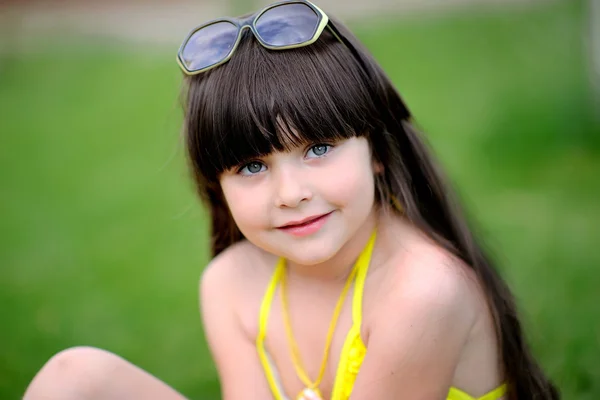 Portrait of little girl outdoors in the tropical style — Stock Photo, Image