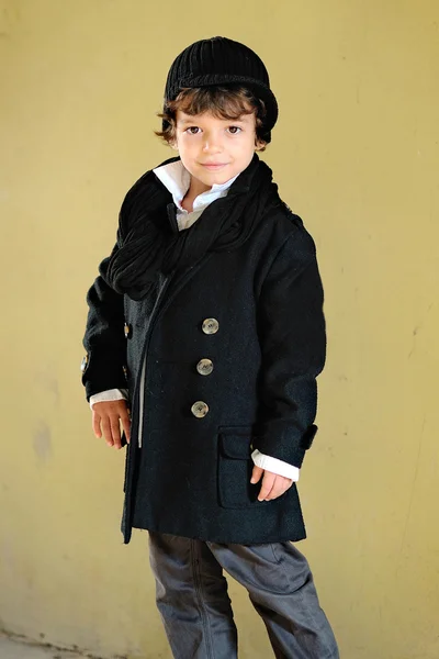 Portrait of little stylish boy outdoors in a coat — Stock Photo, Image