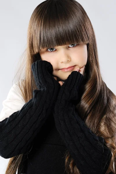 Portrait of a stylish little girl in the studio — Stock Photo, Image