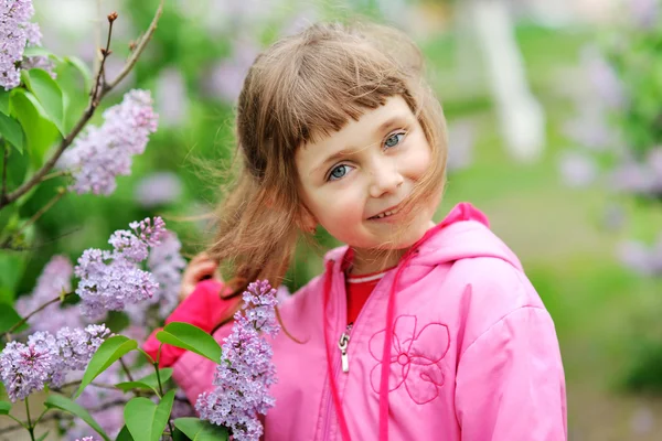 Portrait of a beautiful girl with flowers — Stock Photo, Image