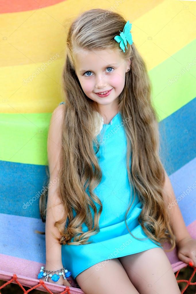 Portrait of little girl outdoors in summer Stock Photo by ©zagorodnaya ...