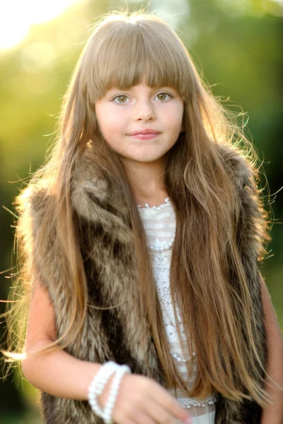 Portrait of a beautiful little brunette girl — Stock Photo, Image