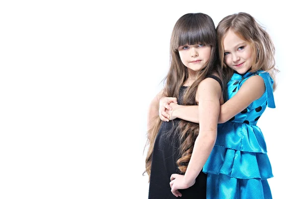 Portrait of two beautiful young girlfriends in studio — Stock Photo, Image